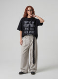 DAXUEN Oversized short-sleeved t-shirt with distressed text print — model photo
