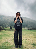 DAXUEN Oversized short-sleeved t-shirt with distressed text print — model photo