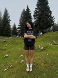 DAXUEN Oversized short-sleeved t-shirt with distressed text print — model photo
