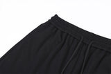 DAXUEN black oversized multi-graphic knit sweatpants
