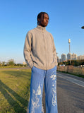 DAXUEN black oversized multi-graphic knit sweatpants — model photo