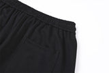 DAXUEN black oversized multi-graphic knit sweatpants