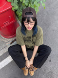 DAXUEN acid-wash multi-panel graphic oversized tee — model photo
