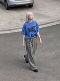 DAXUEN acid-wash multi-panel graphic oversized tee — model photo