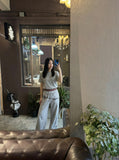 DAXUEN Grey wide-leg sweatpants with musical print and plaid details — model photo