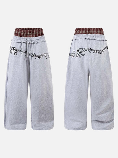 DAXUEN Grey wide-leg sweatpants with musical print and plaid details