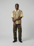 DAXUEN Short-sleeve collared shirt with plaid and polka dot design — model photo