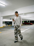 DAXUEN muted camouflage wide-leg pants — model photo