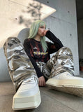 DAXUEN muted camouflage wide-leg pants — model photo
