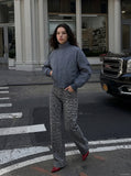 DAXUEN muted grey-blue sculptural bomber jacket — model photo