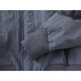 DAXUEN muted grey-blue sculptural bomber jacket