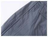 DAXUEN muted grey-blue sculptural bomber jacket