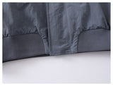 DAXUEN muted grey-blue sculptural bomber jacket