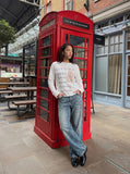 DAXUEN white muted portrait graphic long-sleeve Henley T-shirt — model photo