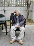 DAXUEN dark muted purple padded parka jacket with grey faux fur lining — model photo
