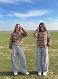 DAXUEN muted blue-grey striped long-sleeve top — model photo