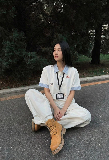 DAXUEN Cat embroidered polo shirt with striped collar — model photo