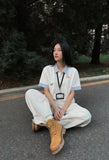 DAXUEN Cat embroidered polo shirt with striped collar — model photo