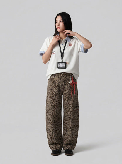 DAXUEN Cat embroidered polo shirt with striped collar — model photo