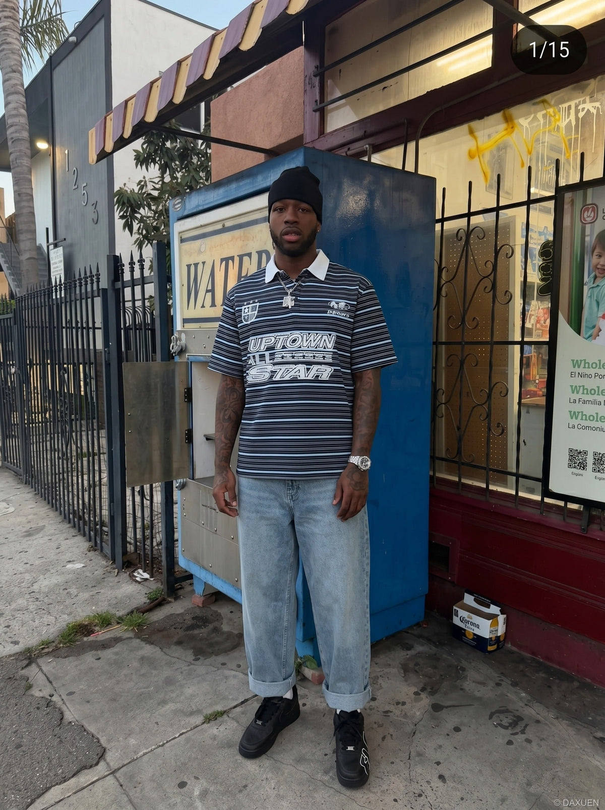 DAXUEN Navy and light blue striped polo shirt — model photo