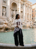 DAXUEN navy blue oversized two-tone '07' graphic jersey top — model photo