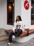 DAXUEN navy blue oversized two-tone '07' graphic jersey top — model photo