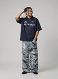 DAXUEN Navy oversized polo shirt with graphics — model photo