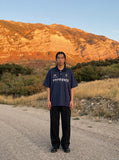 DAXUEN Navy oversized polo shirt with graphics — model photo