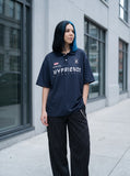 DAXUEN Navy oversized polo shirt with graphics — model photo