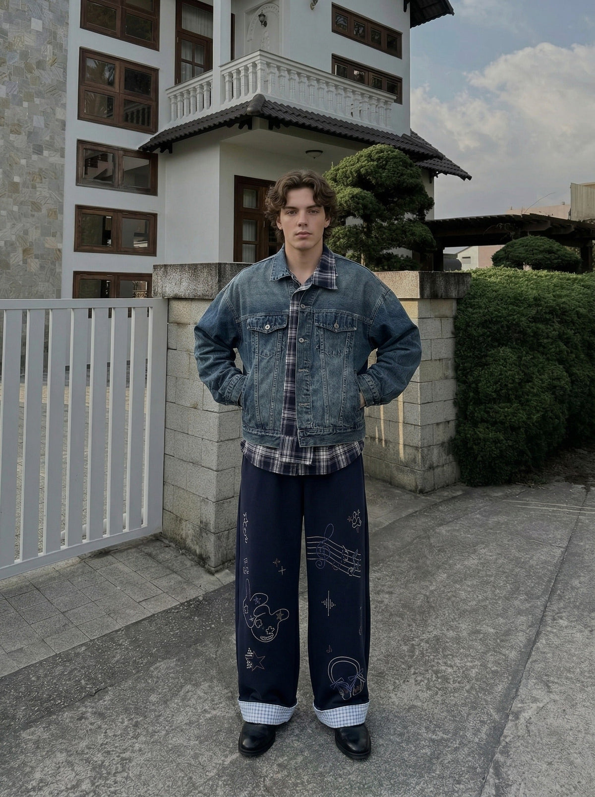 DAXUEN Navy wide-leg sweatpants with embroidered graphics — model photo