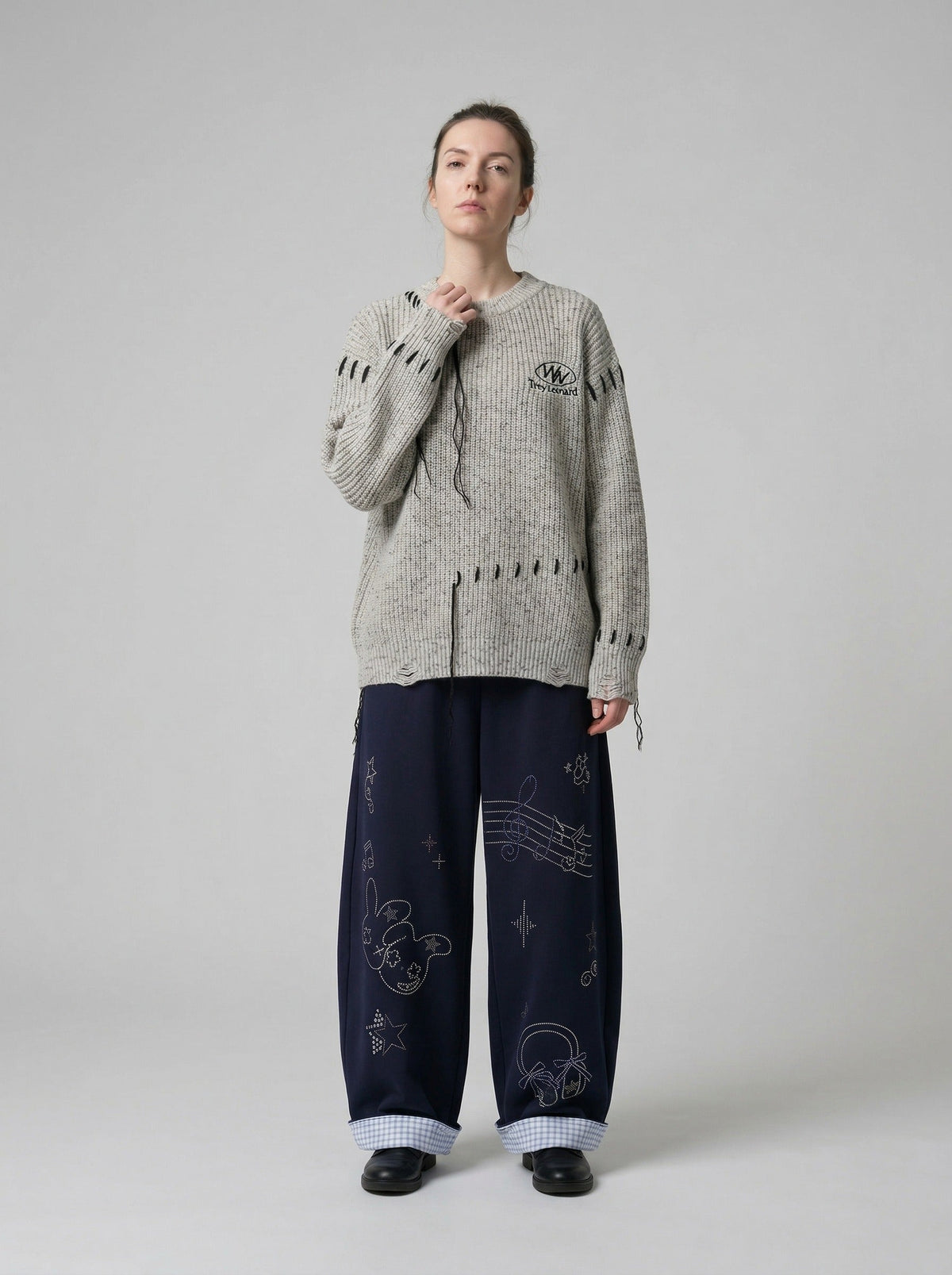 DAXUEN Navy wide-leg sweatpants with embroidered graphics — model photo
