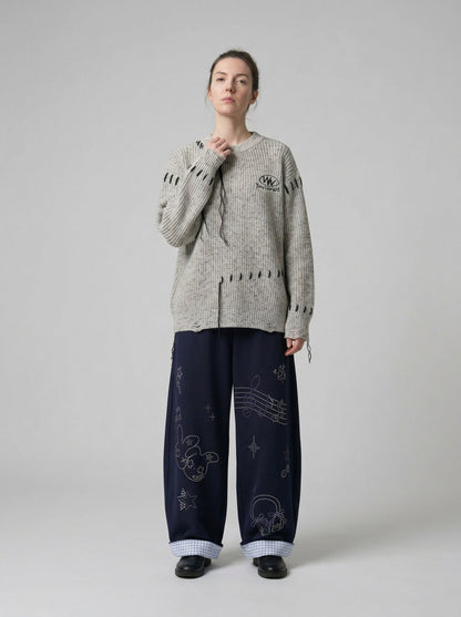 DAXUEN Navy wide-leg sweatpants with embroidered graphics — model photo