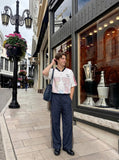 DAXUEN dark navy wide-leg trousers with gold stripes — model photo