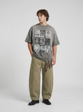 DAXUEN faded grey nine-panel newsprint graphic tee — model photo