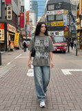 DAXUEN faded grey nine-panel newsprint graphic tee — model photo