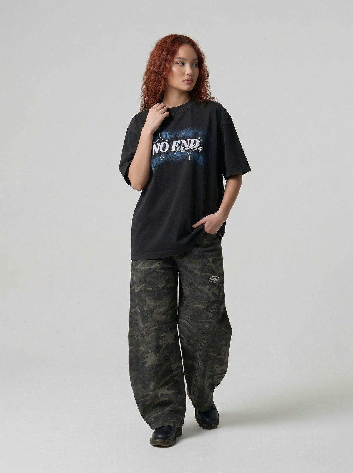 DAXUEN Oversized graphic T-shirt with text and abstract design — model photo