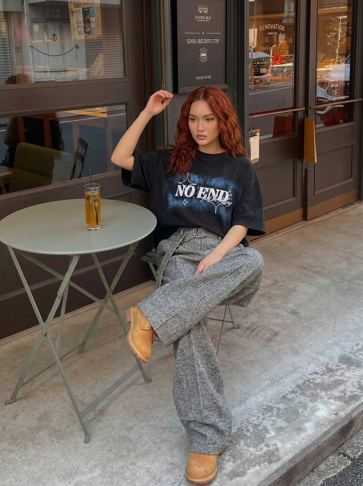 DAXUEN Oversized graphic T-shirt with text and abstract design — model photo