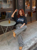 DAXUEN Oversized graphic T-shirt with text and abstract design — model photo