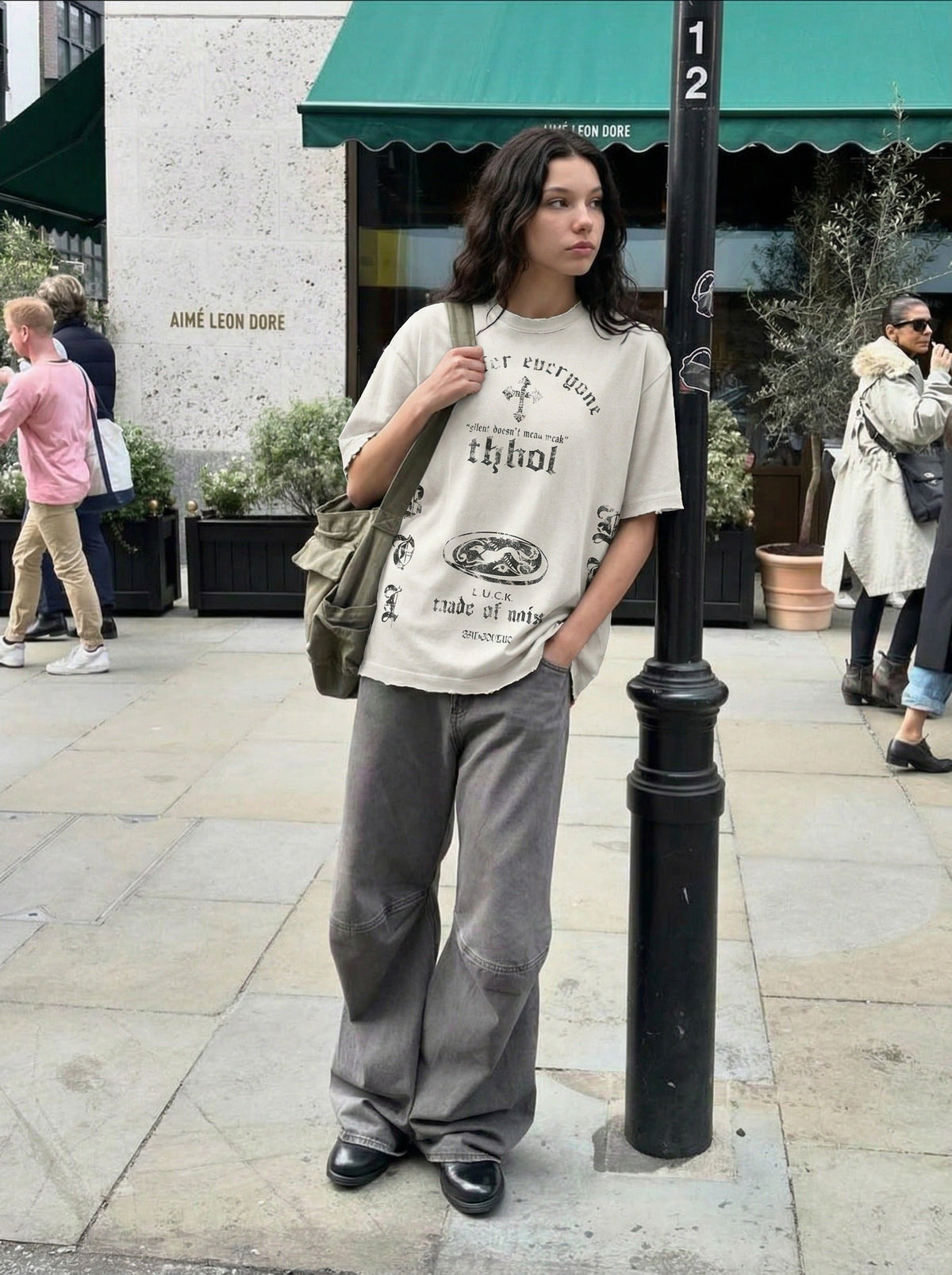 DAXUEN Distressed oversized crew-neck t-shirt with graphic prints — model photo