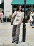 DAXUEN Distressed oversized crew-neck t-shirt with graphic prints — model photo