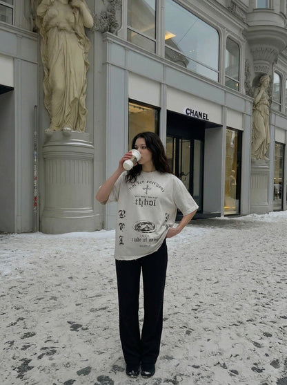 DAXUEN Distressed oversized crew-neck t-shirt with graphic prints — model photo