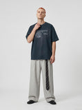 DAXUEN Oversized graphic T-shirt featuring hourglass design — model photo