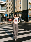 DAXUEN white and navy off-shoulder angelic graphic top — model photo