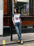DAXUEN white and navy off-shoulder angelic graphic top — model photo