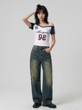 DAXUEN white and navy off-shoulder angelic graphic top — model photo