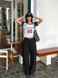 DAXUEN white and navy off-shoulder angelic graphic top — model photo