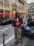 DAXUEN olive camouflage wide-leg pants with pink stripes — model photo