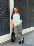 DAXUEN olive green wide-leg cargo pants — model photo