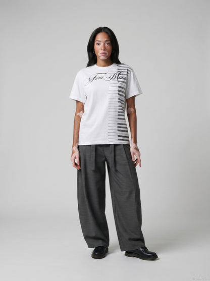 DAXUEN Ornate script and piano key graphic T-shirt — model photo