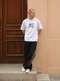 DAXUEN Ornate script graphic short-sleeved T-shirt — model photo